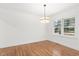 Bright dining room with hardwood floors and modern light fixture at 303 Forest Rd, Oxford, NC 27565