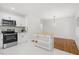 Kitchen island with butcher block top and white cabinets at 303 Forest Rd, Oxford, NC 27565
