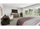 Bright bedroom with large windows, plush bed, and plenty of natural light at 4041 Elk Creek Ln # 16, Raleigh, NC 27612