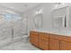 Modern bathroom with double vanity, quartz countertop, and glass shower at 507 Excelsior Ct, Rolesville, NC 27587