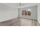 Spacious bedroom with large window and hardwood floors at 507 Excelsior Ct, Rolesville, NC 27587