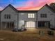 Night view of three-unit building, showcasing rear and lighting at 507 Excelsior Ct, Rolesville, NC 27587