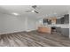 Open living room and kitchen with hardwood floors and modern finishes at 507 Excelsior Ct, Rolesville, NC 27587