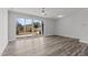 Spacious living area with hardwood floors and sliding glass doors to backyard at 507 Excelsior Ct, Rolesville, NC 27587