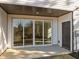 Private patio with sliding glass doors leading to interior at 507 Excelsior Ct, Rolesville, NC 27587