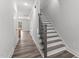 Stylish staircase with dark wood treads and metal railing at 507 Excelsior Ct, Rolesville, NC 27587