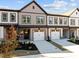 Two-story townhome featuring a neutral color palette and attached garage at 509 Excelsior Ct, Rolesville, NC 27587