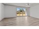 Bright Gathering room with sliding glass doors and hardwood floors at 509 Excelsior Ct, Rolesville, NC 27587