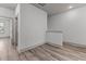 Bright hallway with wood flooring and access to bedrooms at 509 Excelsior Ct, Rolesville, NC 27587