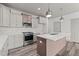 Sleek kitchen with stainless steel appliances and a large island at 509 Excelsior Ct, Rolesville, NC 27587