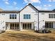 Three-unit building showcasing rear patio access at 509 Excelsior Ct, Rolesville, NC 27587