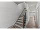 Elegant staircase with dark wood railing and white risers at 509 Excelsior Ct, Rolesville, NC 27587