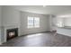 Open concept living area with fireplace and kitchen access at 929 Canis Minor Rd, Wendell, NC 27591