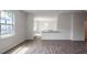 Open floor plan with kitchen and hardwood floors at 929 Canis Minor Rd, Wendell, NC 27591