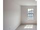Simple bedroom with carpeted floors and a window at 933 Canis Minor Rd, Wendell, NC 27591