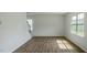 Spacious living room with wood-look floors and large windows at 933 Canis Minor Rd, Wendell, NC 27591