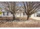 House exterior with landscaping and large trees in front at 113 S Friars Chase Ln, Fuquay Varina, NC 27526