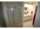 Bathroom with shower, double vanity, and tile flooring at 11321 Involute Pl # 102, Raleigh, NC 27617