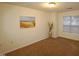 Bright bedroom with large window and sunflower decor at 11321 Involute Pl # 102, Raleigh, NC 27617