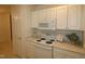 Kitchen with stove, microwave and pantry at 11321 Involute Pl # 102, Raleigh, NC 27617