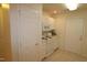 Efficient kitchen with white cabinets and appliances at 11321 Involute Pl # 102, Raleigh, NC 27617