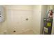 Laundry room with washer, dryer hookups, and water heater at 11321 Involute Pl # 102, Raleigh, NC 27617