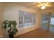 Spacious living room with large window and sliding doors at 11321 Involute Pl # 102, Raleigh, NC 27617