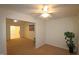 Living room with view into another room and bathroom at 11321 Involute Pl # 102, Raleigh, NC 27617