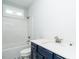 Modern bathroom with white vanity, shower, and bathtub at 368 Hampshire Ct, Four Oaks, NC 27524