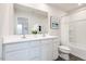 Bright bathroom with double vanity, toilet and shower/tub combo at 481 Autumn Moon Dr, Zebulon, NC 27597