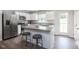 Island kitchen with stainless steel appliances and granite countertops at 481 Autumn Moon Dr, Zebulon, NC 27597