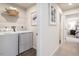 Laundry room with washer and dryer, and overhead shelving at 481 Autumn Moon Dr, Zebulon, NC 27597