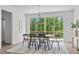 Bright dining room with hardwood floors and sliding glass doors leading to a deck at 6420 Tanner Oak Ln, Raleigh, NC 27613