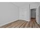 Well-lit bedroom with wood-look floors and doors at 703 Jamescroft Way, Rolesville, NC 27587
