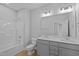 Clean bathroom with double vanity and bathtub at 709 Jamescroft Way, Rolesville, NC 27587
