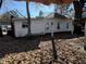 Rear view of a white sided house needing renovations at 762 Nashville Rd, Rocky Mount, NC 27803