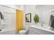 Clean bathroom with a yellow shower curtain, white vanity, and a large mirror at 97 Ethel Ln, Angier, NC 27501