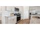 Modern kitchen features granite countertops, stainless steel appliances, and white shaker cabinets at 97 Ethel Ln, Angier, NC 27501