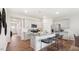 Open kitchen with island, granite countertops, and stainless steel appliances at 97 Ethel Ln, Angier, NC 27501