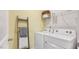 Laundry room with washer, dryer, and shelving at 97 Ethel Ln, Angier, NC 27501