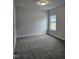 Spacious bedroom with neutral colored carpet at 115 Lemon Drop Ln, Franklinton, NC 27525