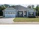Charming one-story home with gray siding and stone accents at 115 Lemon Drop Ln, Franklinton, NC 27525
