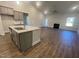 Open kitchen with granite island and breakfast bar at 115 Lemon Drop Ln, Franklinton, NC 27525