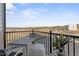 Private balcony with table and chairs, community view at 1235 Shaw View Alley # 201, Raleigh, NC 27601