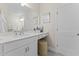 Modern bathroom with white vanity and a large mirror at 1235 Shaw View Alley # 201, Raleigh, NC 27601