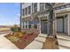 Brick front exterior of townhome with landscaped garden at 1235 Shaw View Alley # 201, Raleigh, NC 27601