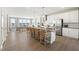 Modern kitchen with island, stainless steel appliances at 1235 Shaw View Alley # 201, Raleigh, NC 27601