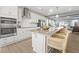 Modern kitchen with white cabinets and large island at 1235 Shaw View Alley # 201, Raleigh, NC 27601
