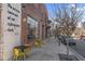 Brick building with outdoor seating and quote art at 1235 Shaw View Alley # 201, Raleigh, NC 27601