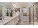 Double vanity bathroom with a large mirror and a separate shower at 166 Blue Butterfly Dr, Angier, NC 27501